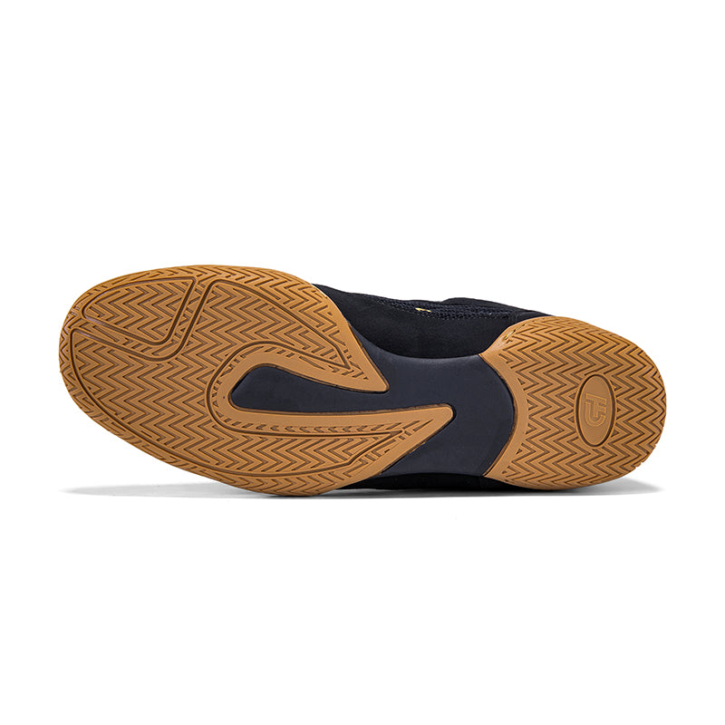 The outsole of a dark bl
ack CH Gear XXVI Throne Wrestling Shoe, showing a textured tan and navy blue tread pattern, photographed on a clean white background.