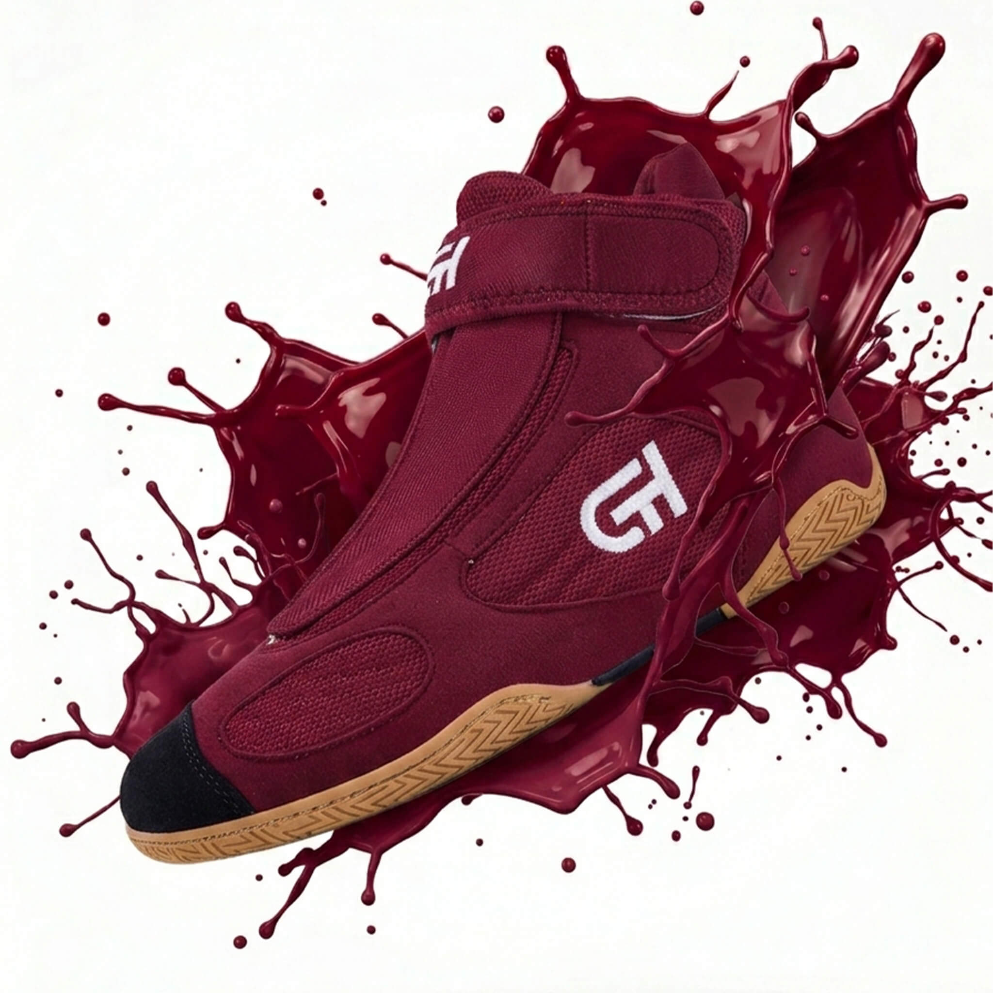 A high-top athletic CH Gear XXVI Heritage Wrestling Shoe in deep burgundy with a white stylized 'G' logo on the side, black toe cap, and tan sole, shown emerging from a glossy dark red paint splash against a white background.
