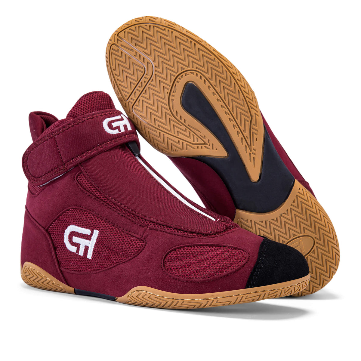 A pair of high-top athletic CH Gear XXVI Heritage Wrestling Shoe in burgundy with black accents and a tan sole, shown on a white background with one shoe standing upright and the other lying on its side to display the sole.