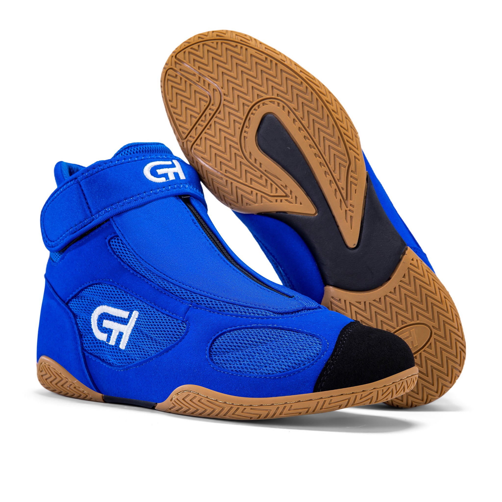A pair of high-top athletic CH Gear XXVI Sonic Wrestling Shoe in bright royal blue with black toe and heel caps, a hook-and-loop strap with a white logo, and tan textured outsoles. One shoe is shown from the side and front, while the other is turned to display the sole.