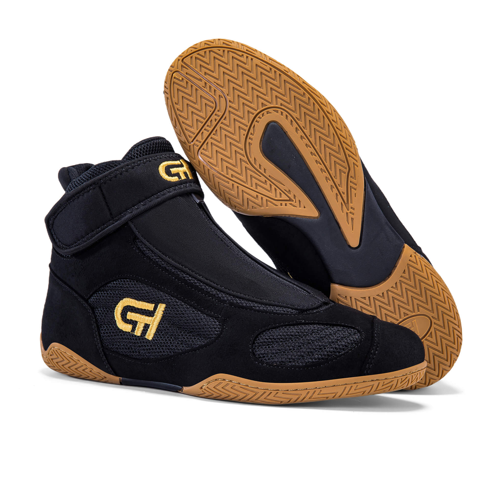 A pair of black high-top athletic CH Gear XXVI Throne Wrestling Shoes with gold 'GH' logos, showing both the side profile and the textured brown outsole against a white background.