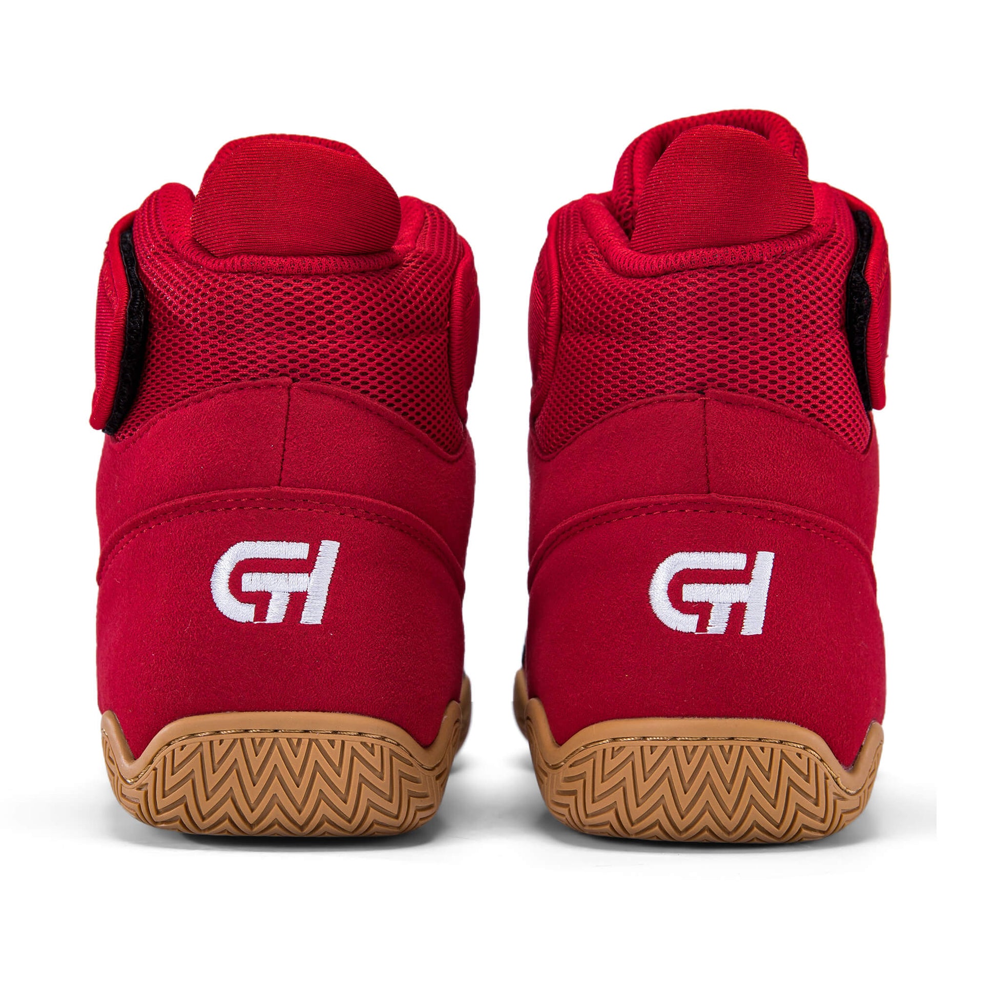 Rear view of a pair of red and black high-top wrestling shoes with tan patterned soles and “CH Gear” logos on the heels.
